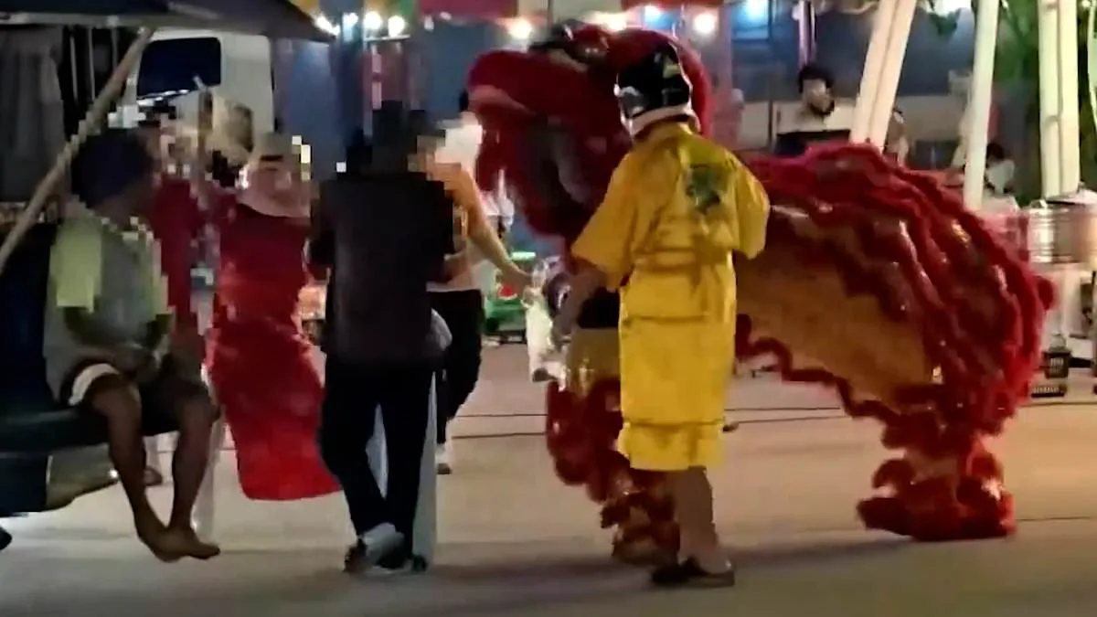 Thai Police Dazzle in Red Dragon Costume During Lunar New Year Art Theft Sting