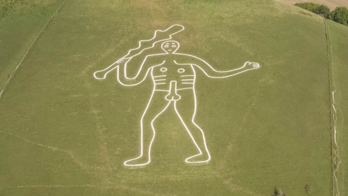Restoration crew applies 17 tonnes of chalk to Britain's giant statue.