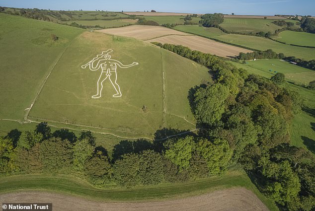 Restoration crew applies 17 tonnes of chalk to Britain's giant statue.