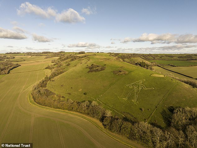 Restoration crew applies 17 tonnes of chalk to Britain's giant statue.