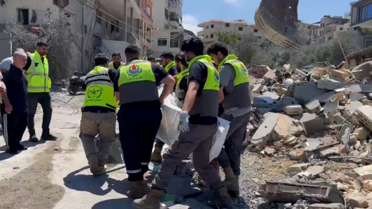 Israeli military intercepts Hezbollah aerial assault, causing damage in Kiryat Shmona.